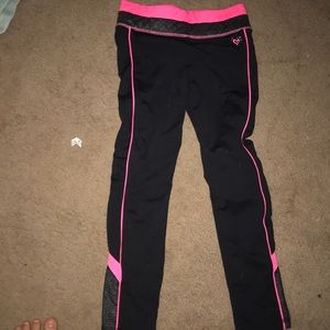 size 10 pair of pink and black justice leggings
